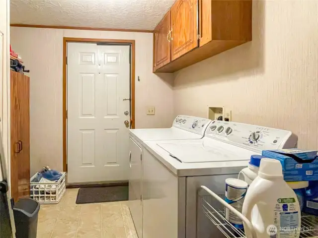 Laundry room with door to parking area