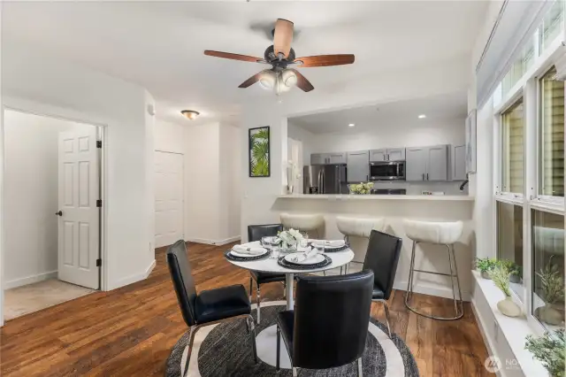 Enjoy the openness that the breakfast bar and kitchen window create between the two spaces.
