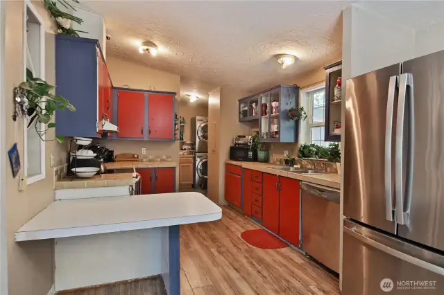 Another angle of the kitchen. The laundry is just beyond with extra storage and a door that leads to the back yard.