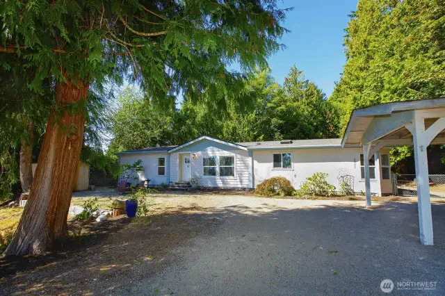 Large drive for plenty of parking along with 1 carport parking