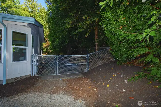Large fully fenced back yard area. - Could run a driveway to divided back lot area through here.