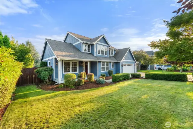 Front porch overlooks large front yard.