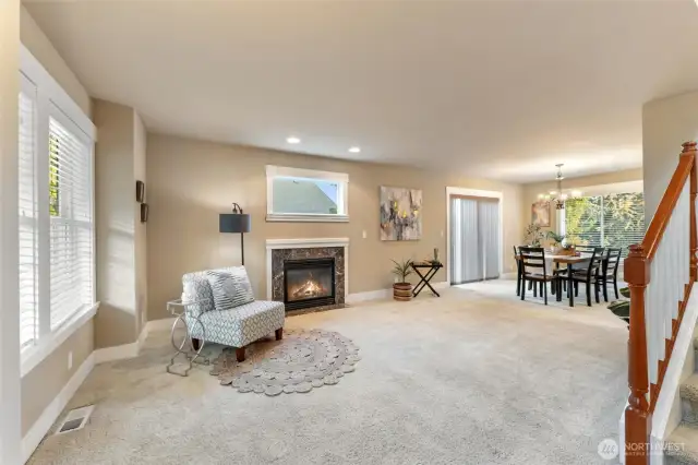 Greeted by a large living space and dining room.