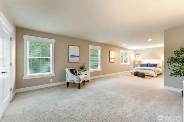 Massive primary bedroom provides plenty of space to relax and unwind.