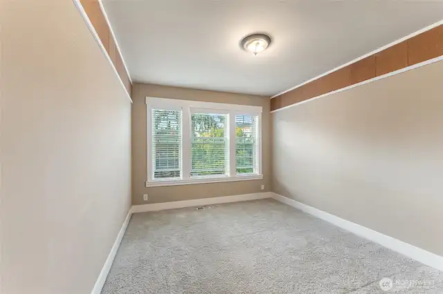 Bedroom #2 has large windows overlooking the front.