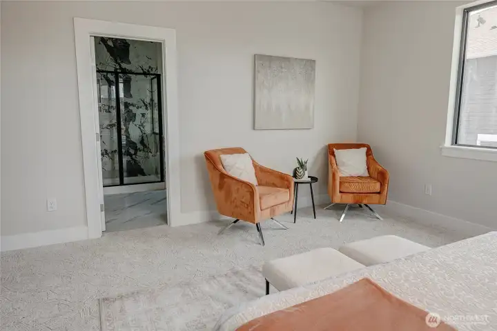 Primary bedroom with extra space to relax