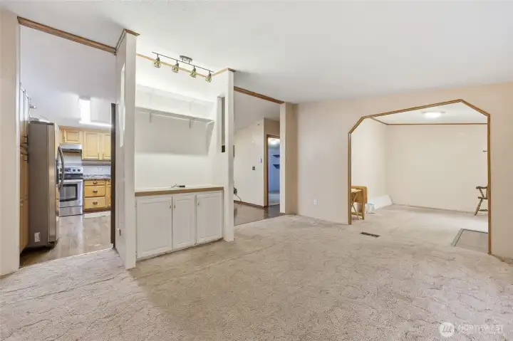 Living room looking toward kitchen and den/office
