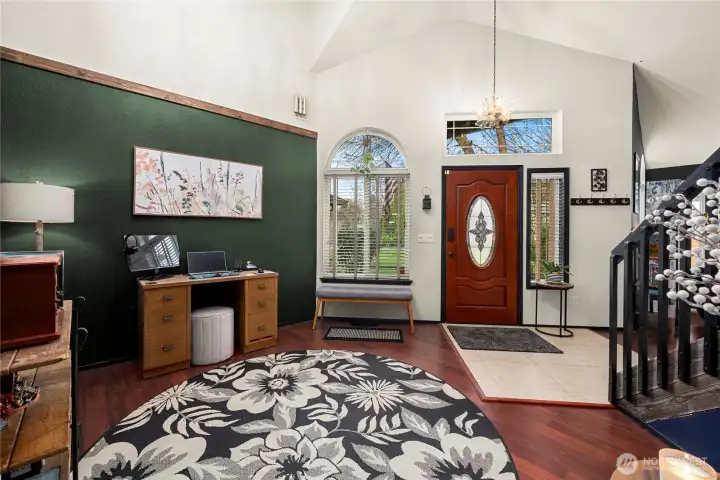 On the other side of the stairs is this entry/office/library/playroom