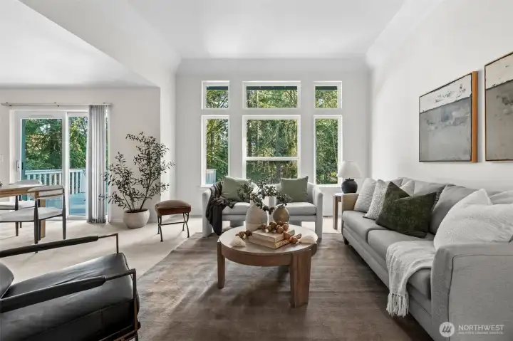 Beautiful collection of windows allows bright natural lighting to showcase this comfortable living room.