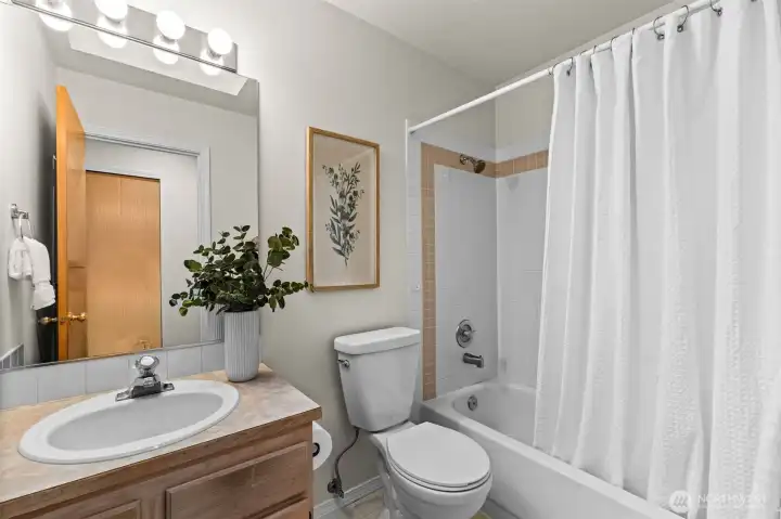 Secondary bathroom filled with a modern ambiance and beautiful bathroom tiling.