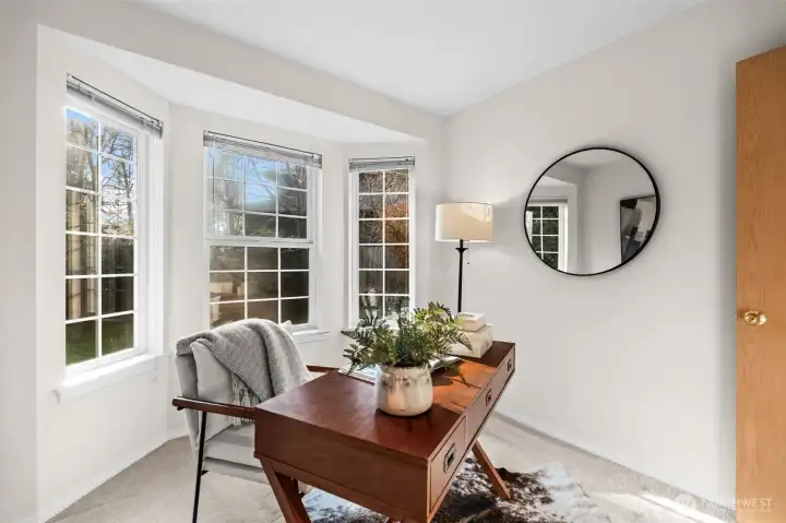 Open windows prioritizes natural light to promote energy and wellness into this office space.