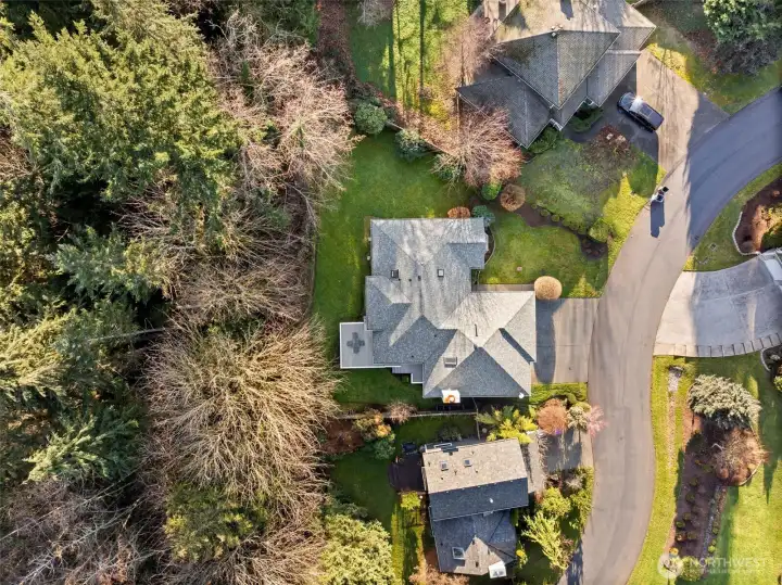 Beautiful partially-fenced yard allows access to enjoy it's wooded greenbelt backyard.