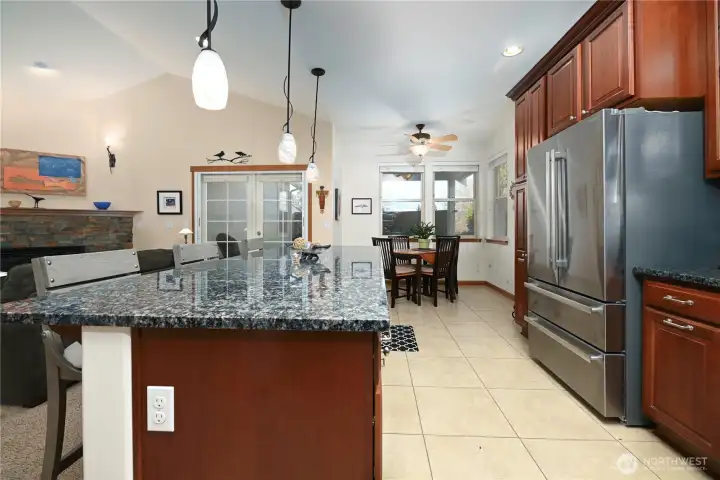 Large kitchen with slab granite.