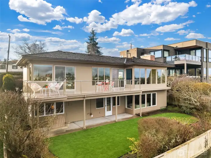 Perched atop Magnolia's west hill, this solid home checks all the boxes!  The level lower turf yard delivers year-round enjoyment without chemicals or mowing, while the main-floor deck spans kitchen-to-dining with sweeping views from Mt. Rainier to Mt Baker.