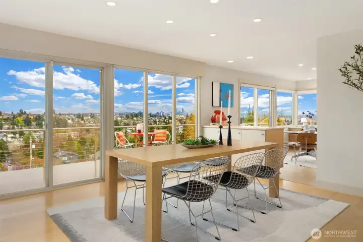 The generous dining room feels connected to both kitchen and living room, while still maintaining its own defined space.  Sliding doors open both kitchen and dining room to the expansive view deck, and allow for awesome circular indoor/outdoor flow on warm days.