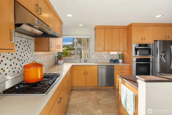 A west-facing window over the sink looks out toward the street, and welcomes late afternoon light.