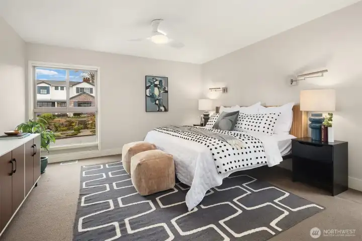 The primary suite easily accommodates a king bed plus sizeable nightstands and a big dresser.  You may or may not need that ceiling fan, as this home is outfitted with Central A/C to keep things nice and cool on hotter days.