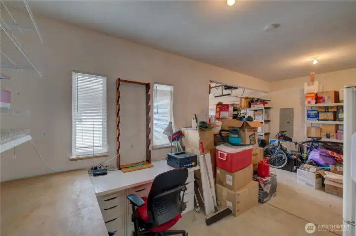 Garage has extra storage or work room space.