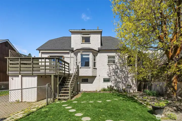 Back of home, awesome entertaining sized deck, fully fenced back yard for your favorite 4 legged friends. Ample parking, RV parking and a detached shop/garage for even more storage. Shop has alley access too!