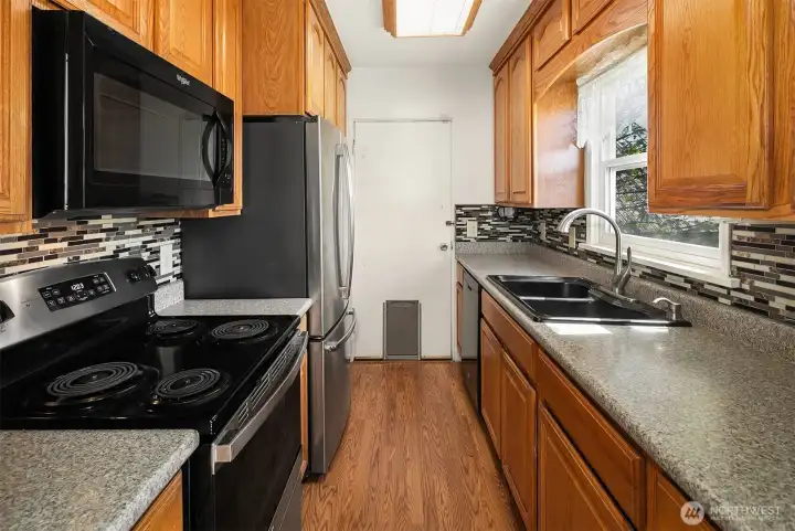 Kitchen with ample cabinetry and good counter top working space.