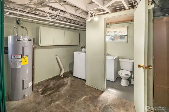 This is the washer/dryer/hot water tank area in the basement. Toilet and sink too!