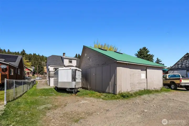 Back side of detached garage and RV storage from alley