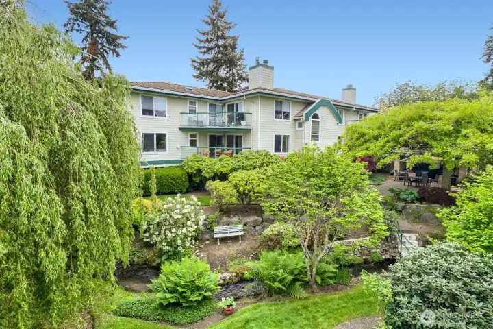 Come Home to Your Own Arboretum! Creekside Mature Growth & Gardens Surround this Downtown Edmonds Condo Retreat. Trails, Multiple Patios & Sitting Areas Throughout Create a Unique Parklike Setting.
