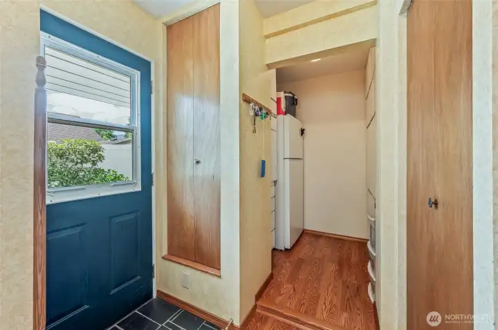 Kitchen pantry w/ door leading to sitting area and steps to parking