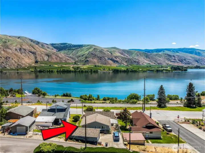 Perched above the road with river views