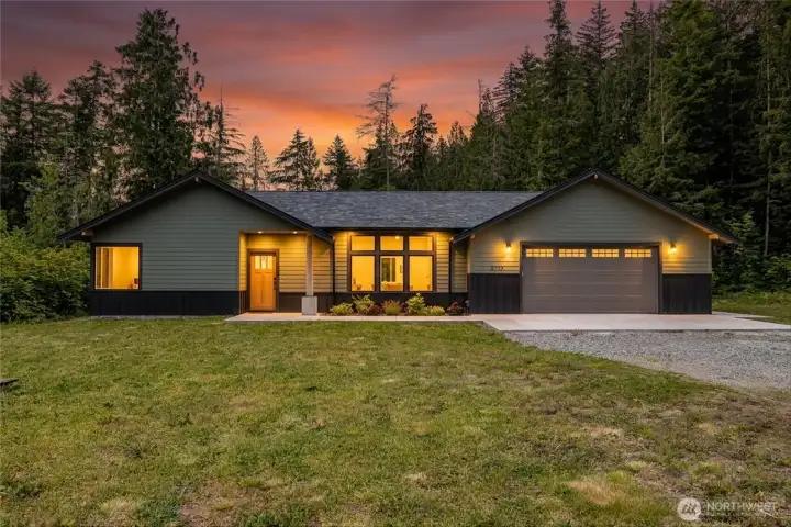 Stunning modern exterior with oversize driveway & peaceful wooded surroundings. Stunning modern exterior with oversize driveway & peaceful wooded surroundings.