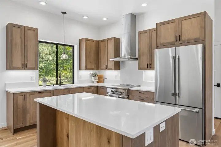 Beautiful chef's kitchen with oversize island and high-end appliances. Beautiful chef's kitchen with oversize island and high-end appliances.