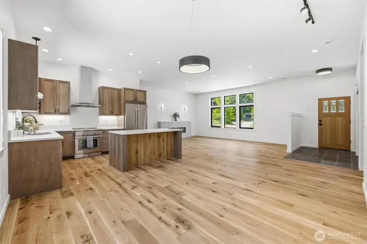Open living and dining space with seamless flow and warm modern touches throughout. Open living and dining space with seamless flow and warm modern touches throughout.