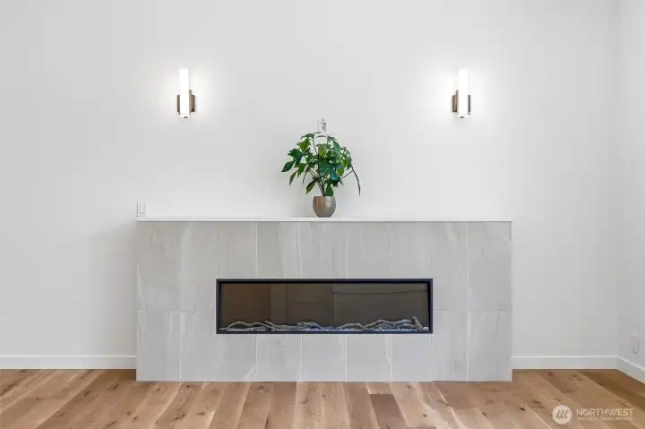 Sleek contemporary fireplace with clean lines and modern wall sconces. Sleek contemporary fireplace with clean lines and modern wall sconces.