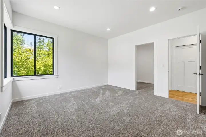 Light-filled bedroom with contemporary finishes and generous layout. Light-filled bedroom with contemporary finishes and generous layout.