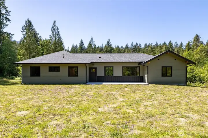Exterior view of the home showcasing peaceful country-style setting. Exterior view of the home showcasing peaceful country-style setting.