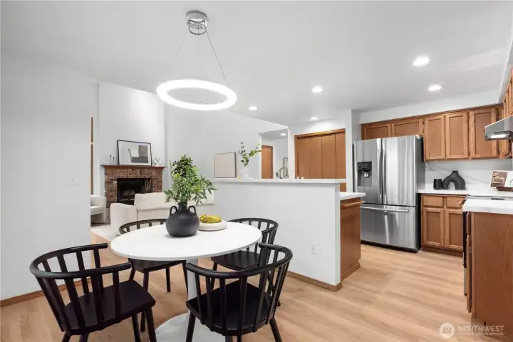 Updated kitchen includes new quartz countertops and stainless steel appliances
