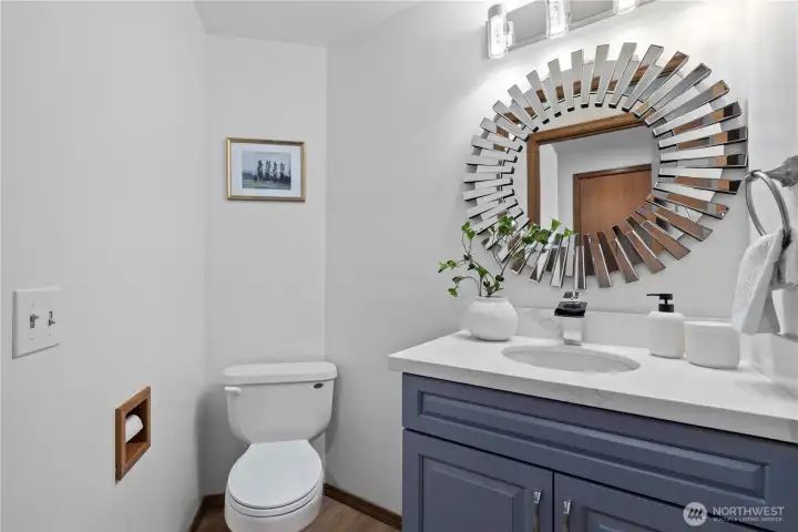 Renovated downstairs bathroom (2026) with new vanity, lighting and paint