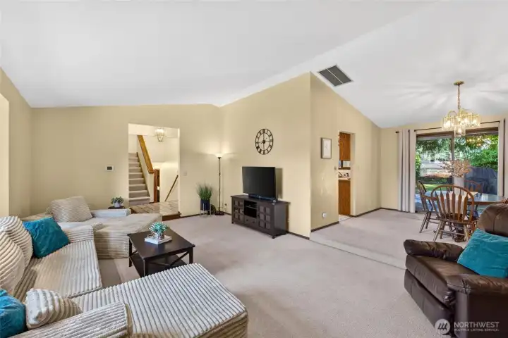 Formal dining room opens to entertainment sized deck.