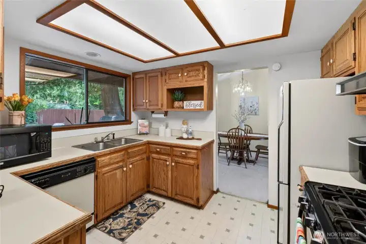 Kitchen offers gas range, pantry, ample counter space and plenty of storage.
