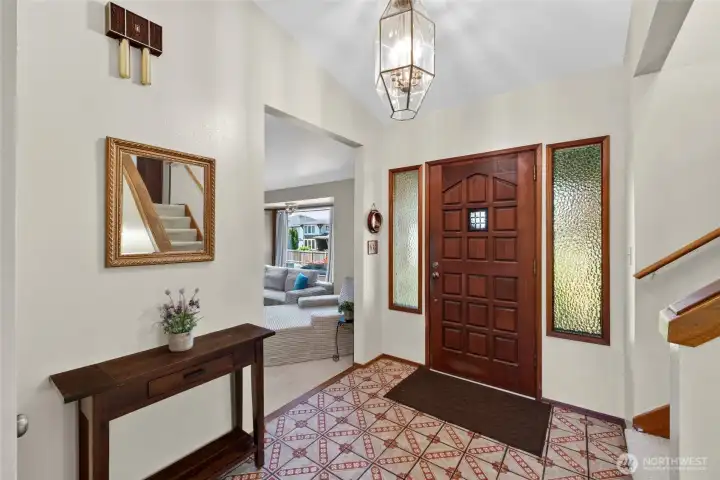 Spacious entry with vaulted ceilings.