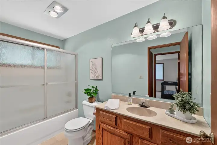 Main hall bathroom with large vanity.
