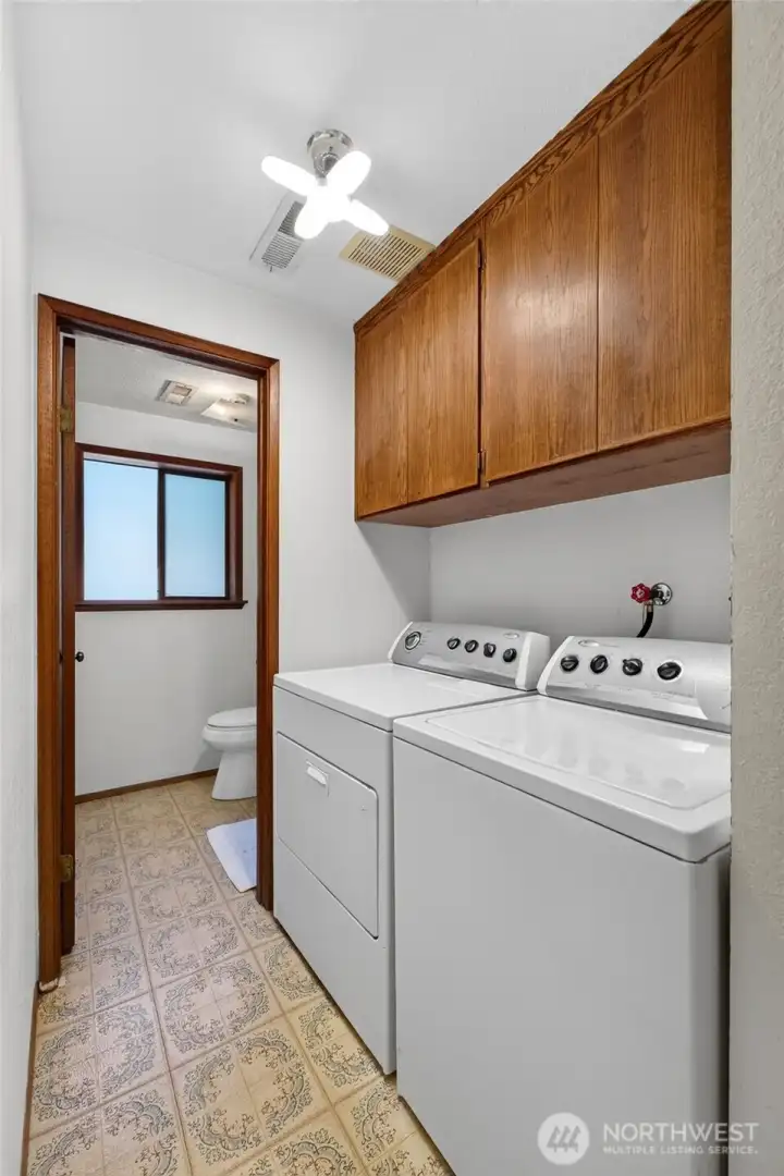 Laundry/1/2 bathroom on lower floor. All appliances stay with home.