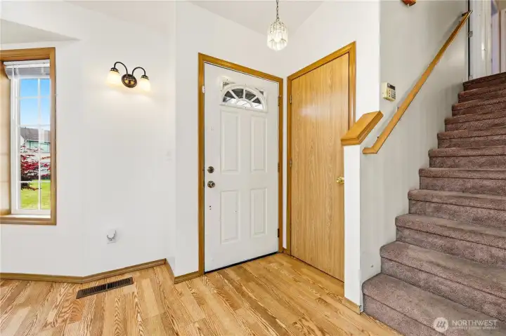 Family room is to the left and stairs to bedrooms is to the right