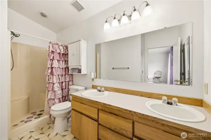Double sink and shower in primary bathroom