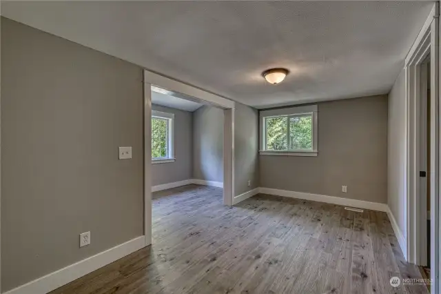 There are two bonus rooms off bedroom #3. This north wing of the home would be ideal for multi-generational living. This room would be a great living room and the area to the left an office or maybe a craft room.