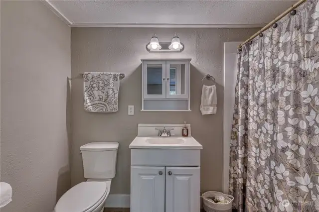 The recently updated full bathroom attached to bedroom #3, it is spotless, making this an ideal ADU suite.