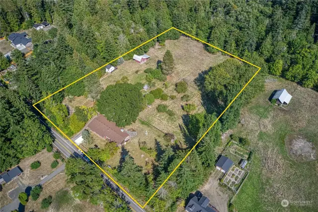 This picture shows the cottage and big red barn along the left property line, also the magnificent oak tree, it is enormous and beautiful.