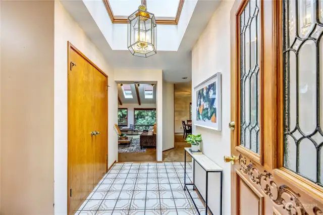 As you enter, large coat closet to the left. Vintage ceramic tile floors.