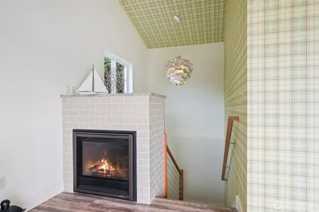 Stairwell with Beautiful Avocado Chandelier and Gorgeous Rail System.