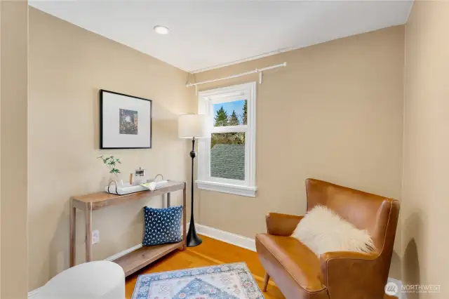 within the primary bedroom is this nook for reading, or an additional home office space